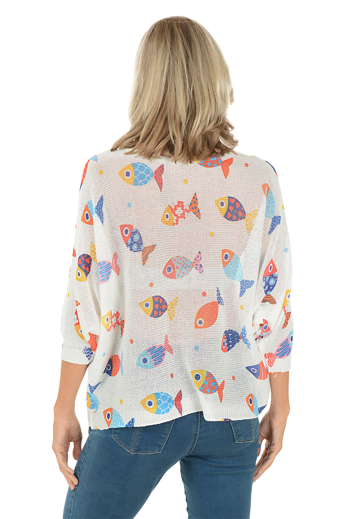 Woman wearing a white sweater with colorful fish patterns on a white background. Back shot.