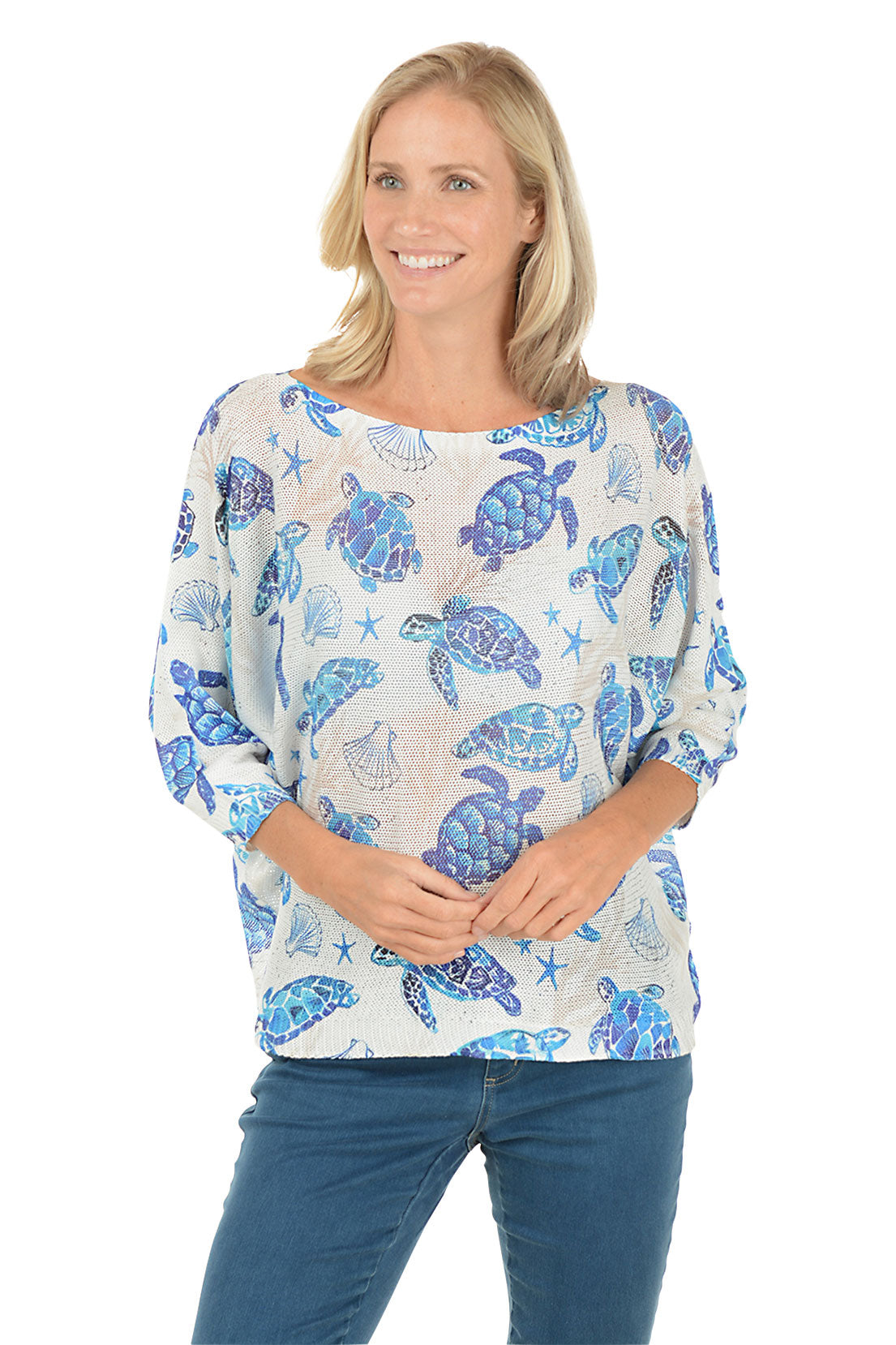 Woman wearing a blue turtle patterned shirt on a white background. Second front shot.