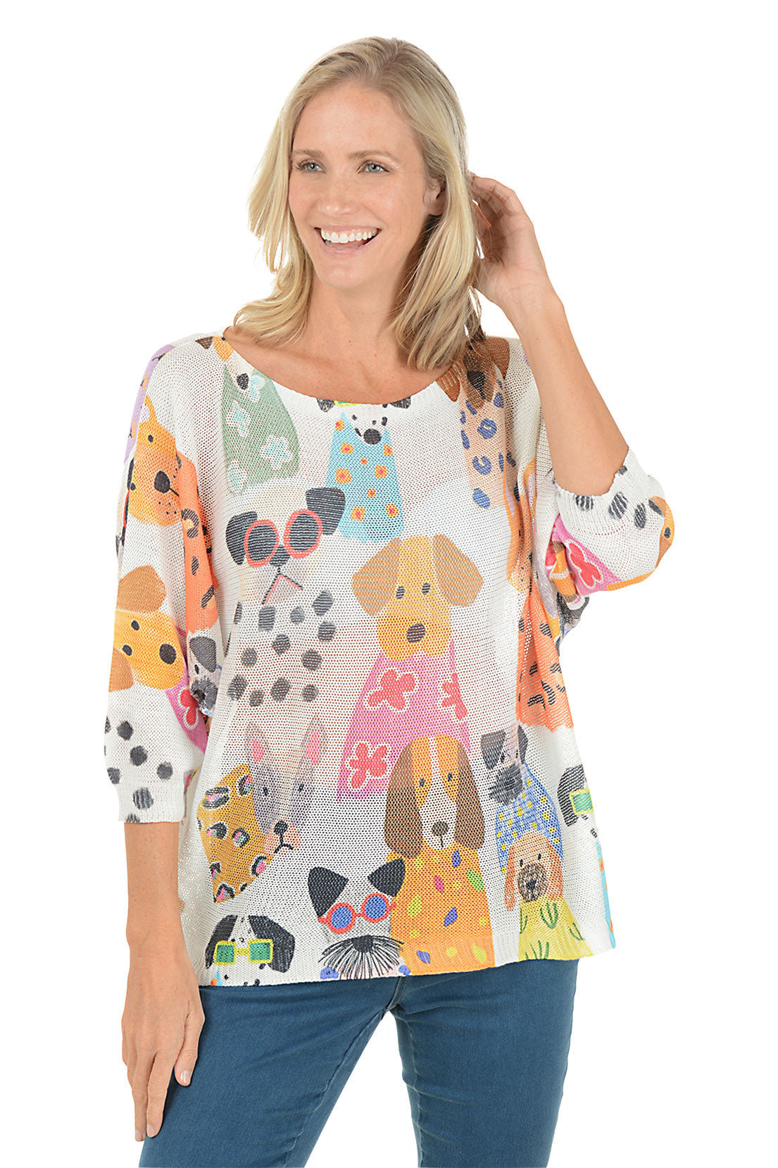 Woman wearing a colorful dog-patterned shirt on a white background.