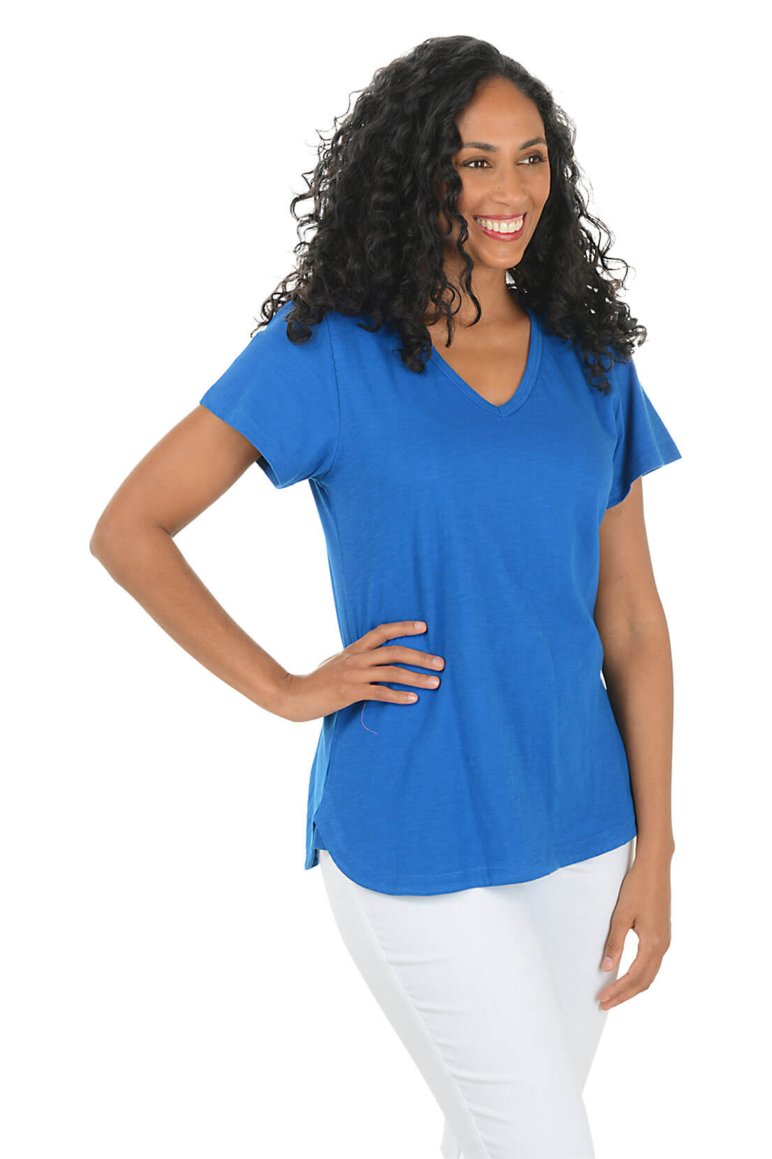 Woman wearing a blue t-shirt and white pants on a white background