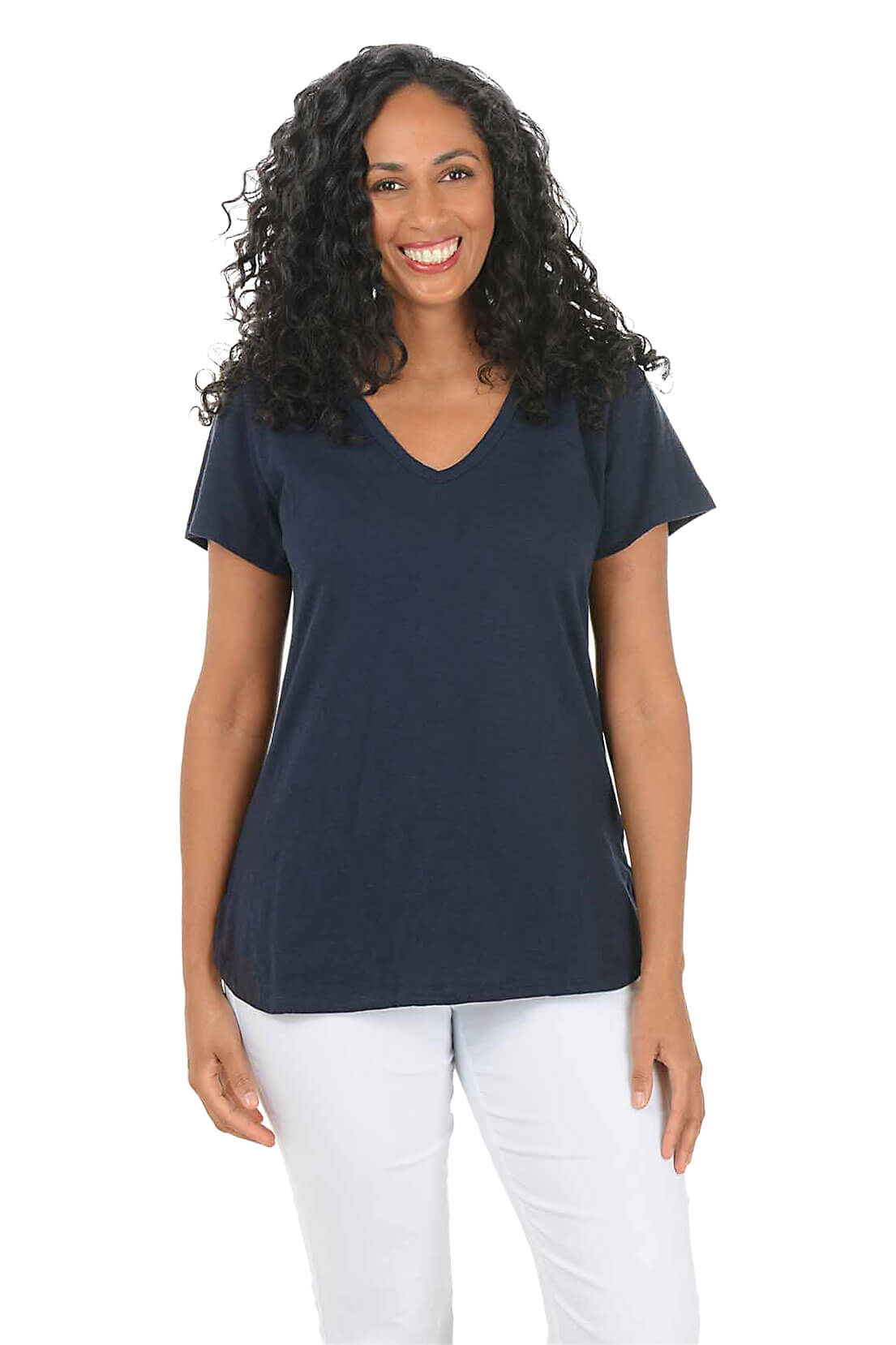 Woman wearing a navy blue t-shirt and white pants on a white background