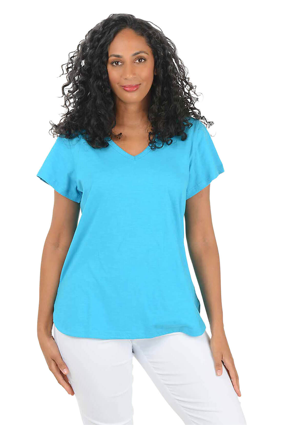 Woman wearing a blue t-shirt and white pants on a white background
