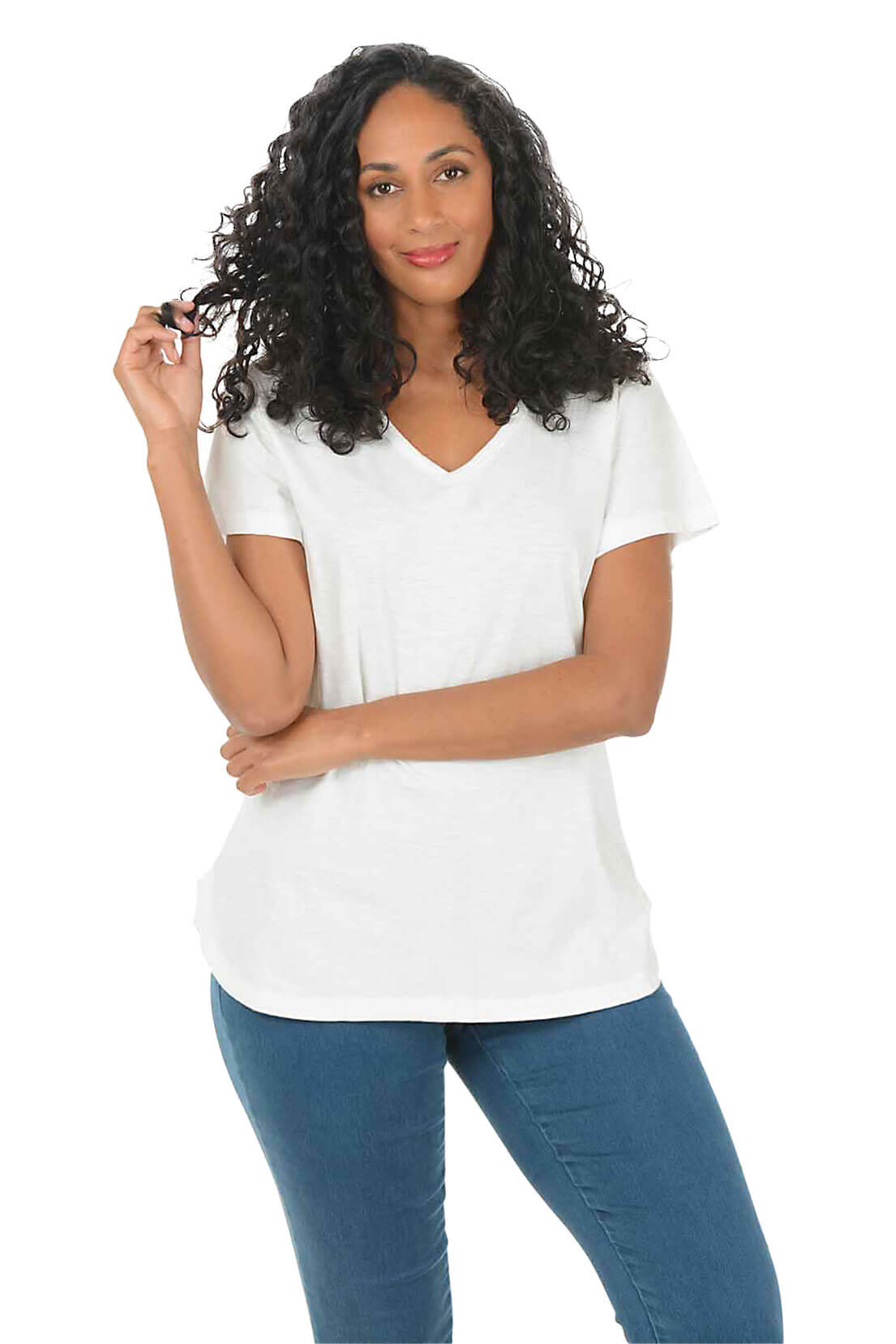 Woman wearing a white t-shirt and blue jeans on a white background