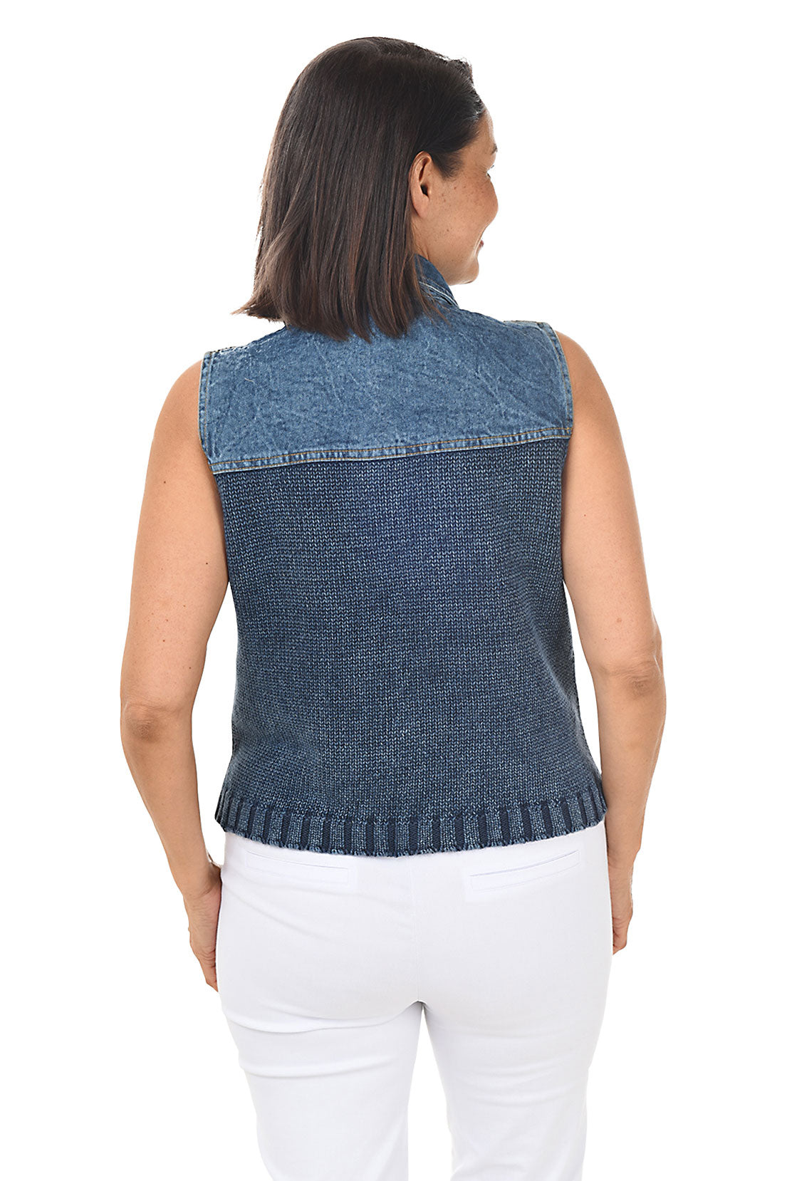 Woman wearing a blue denim vest over a white top on a white background. Back shot.