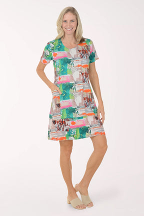 Woman wearing a colorful patterned dress on a white background