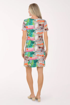 Woman wearing a colorful patterned dress on a white background