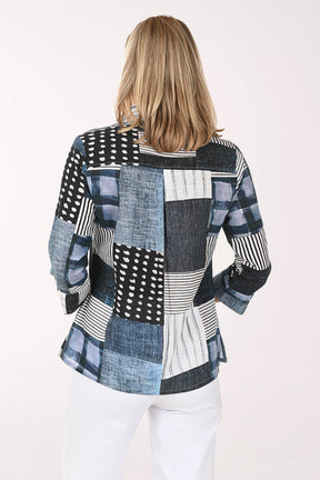 Woman wearing a patchwork shirt with a white background