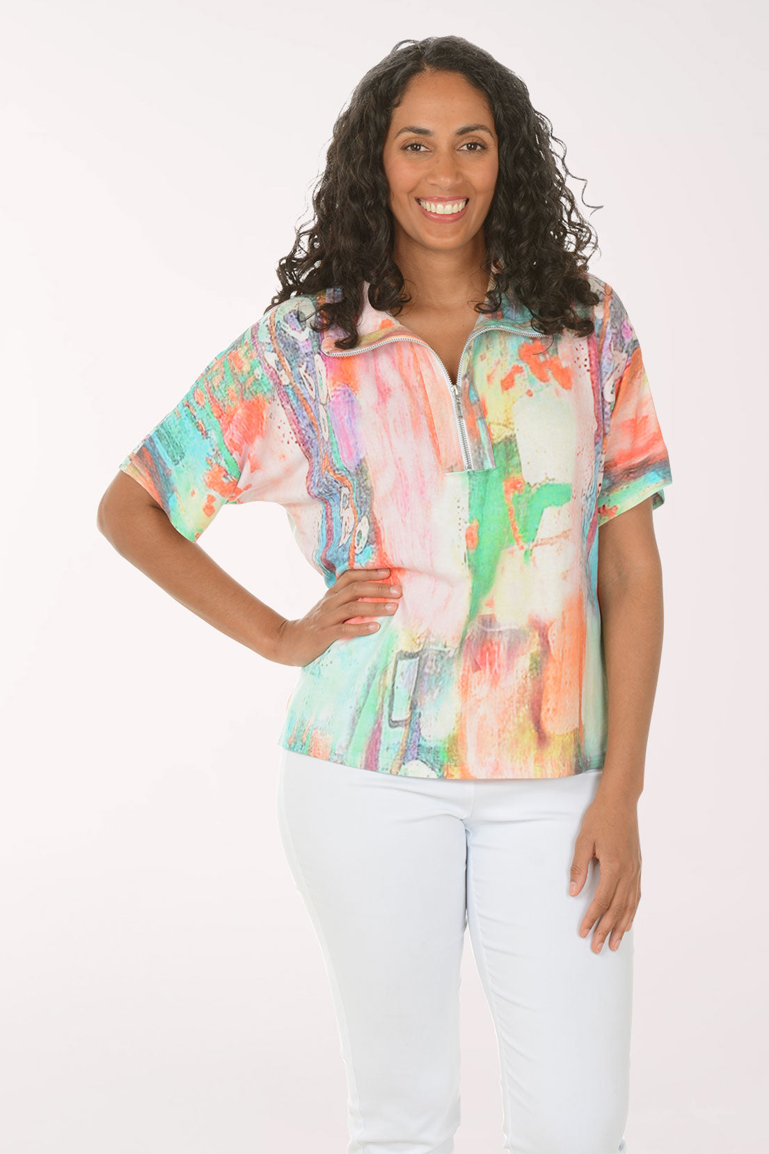 Woman wearing a colorful blouse with a white background