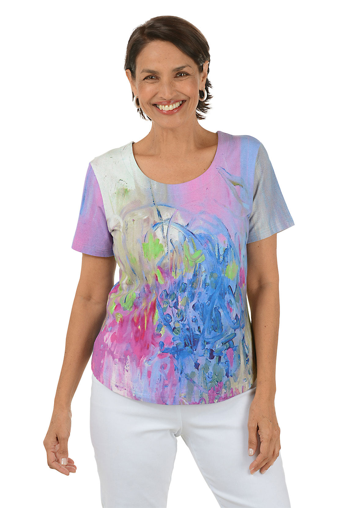 Woman wearing a colorful abstract patterned top on a white background.