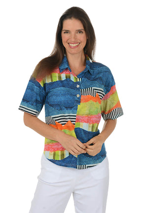 Woman wearing a colorful patterned shirt on a white background