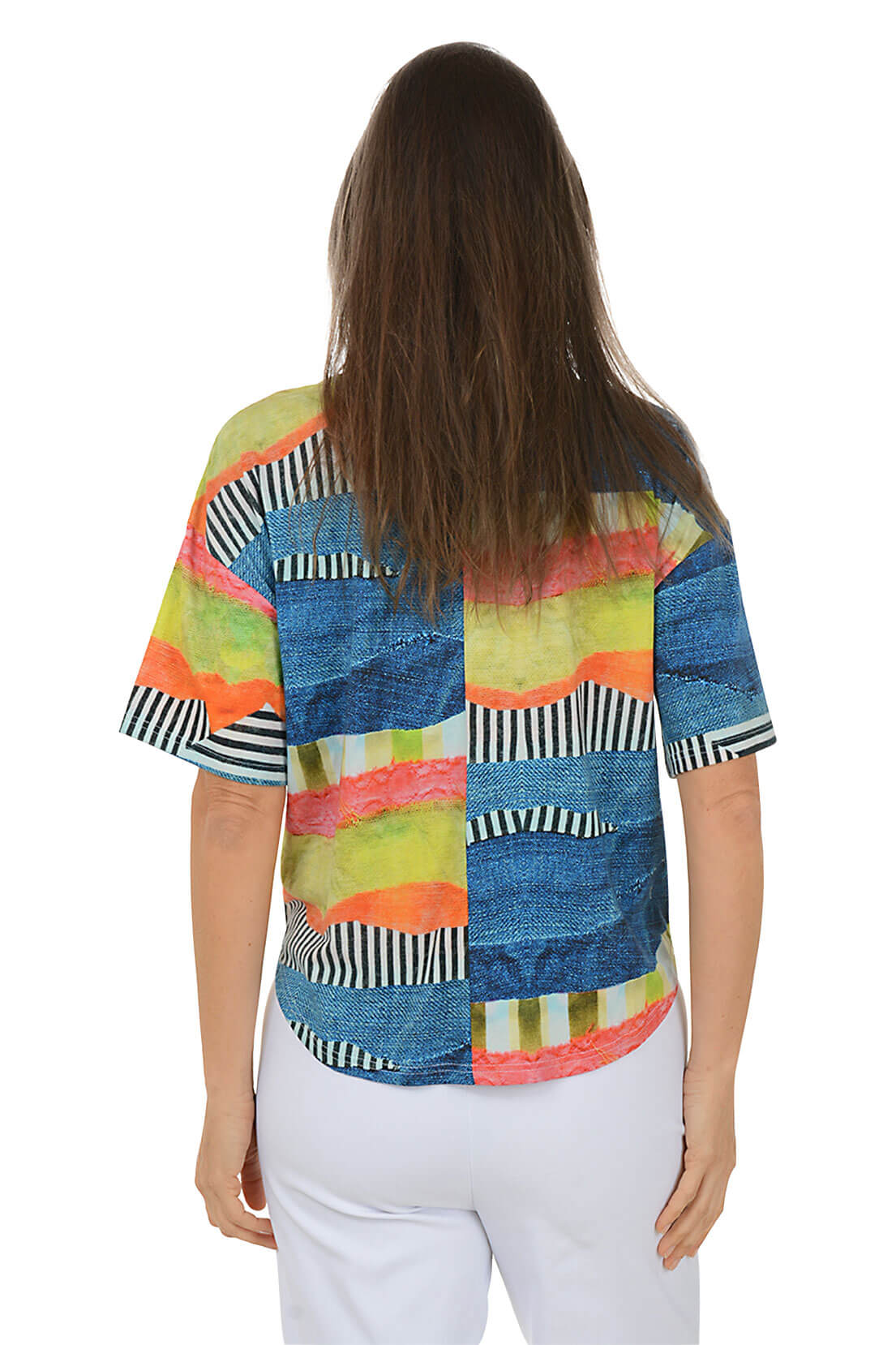 Woman wearing a colorful patterned shirt on a white background