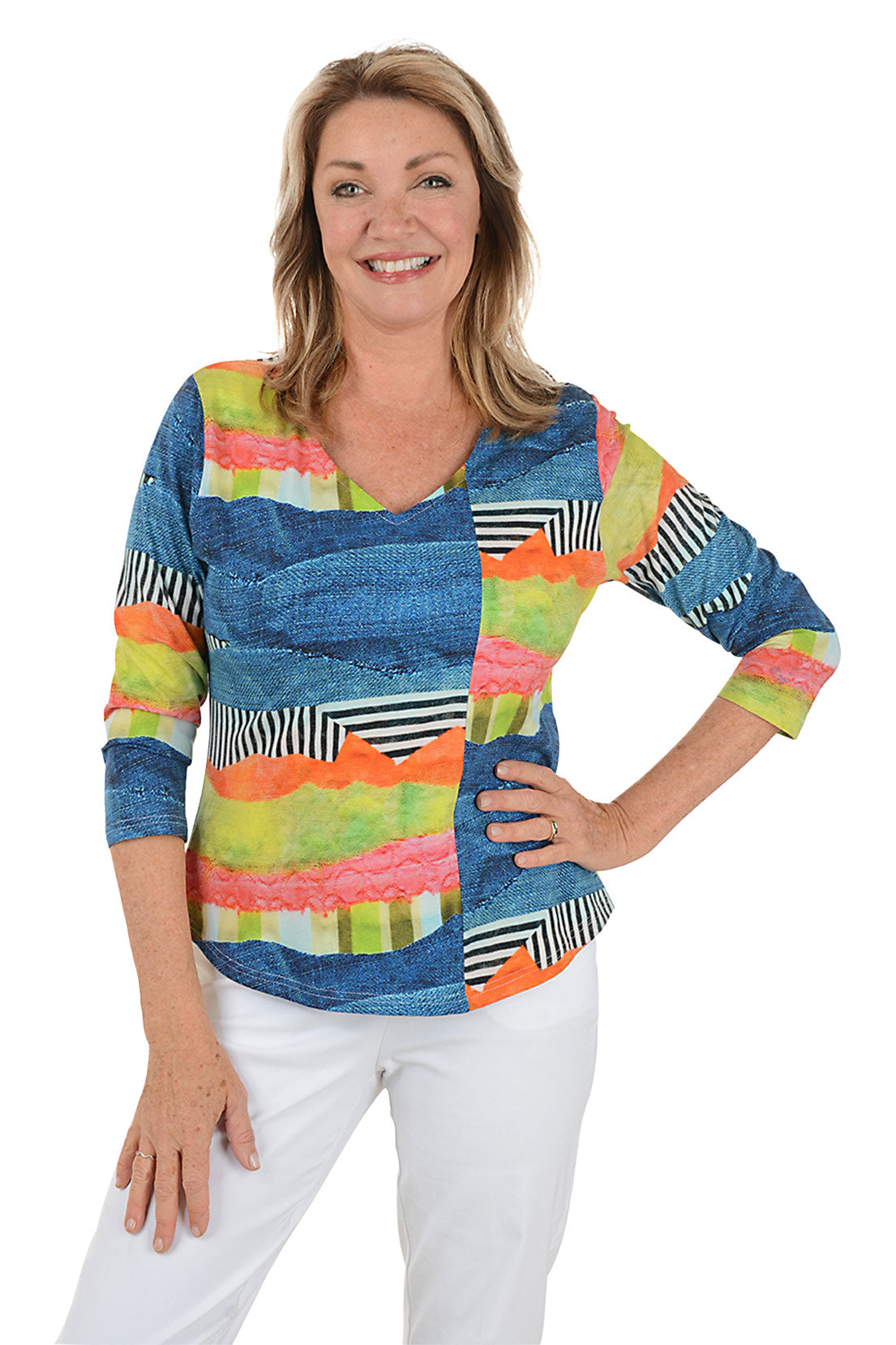 Woman wearing a colorful patterned top with a white background