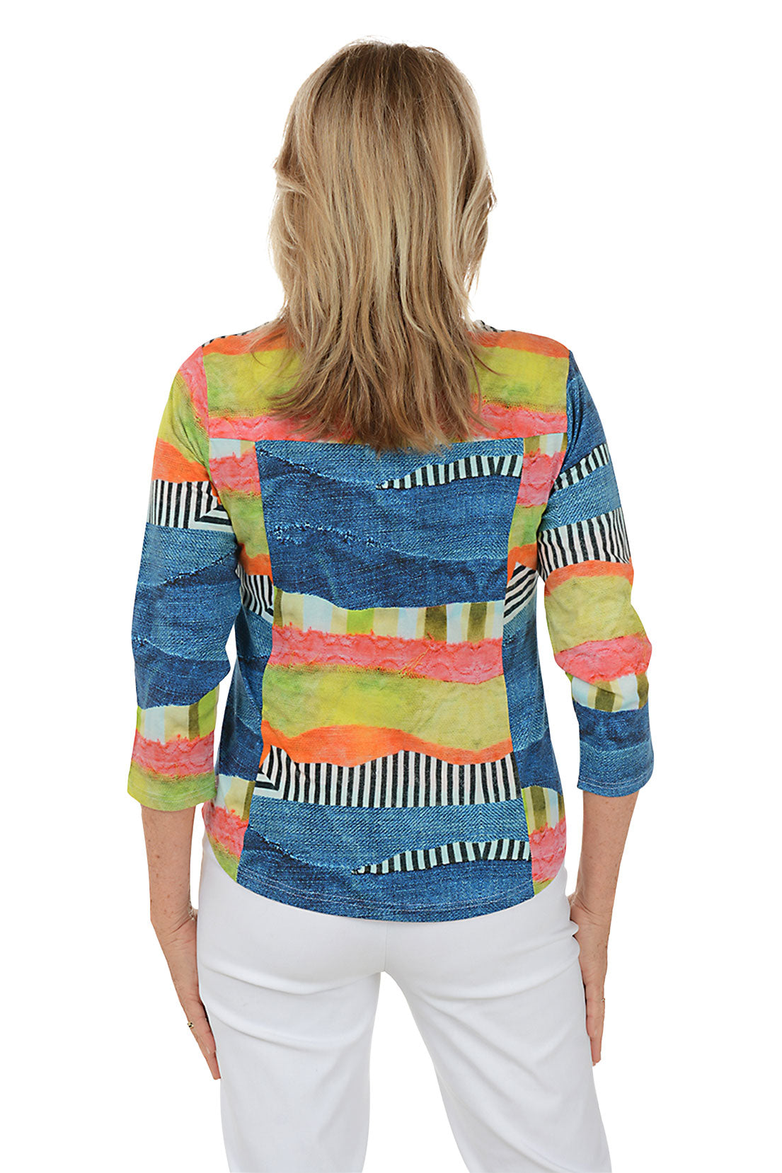 Woman wearing a colorful patterned top with a white background