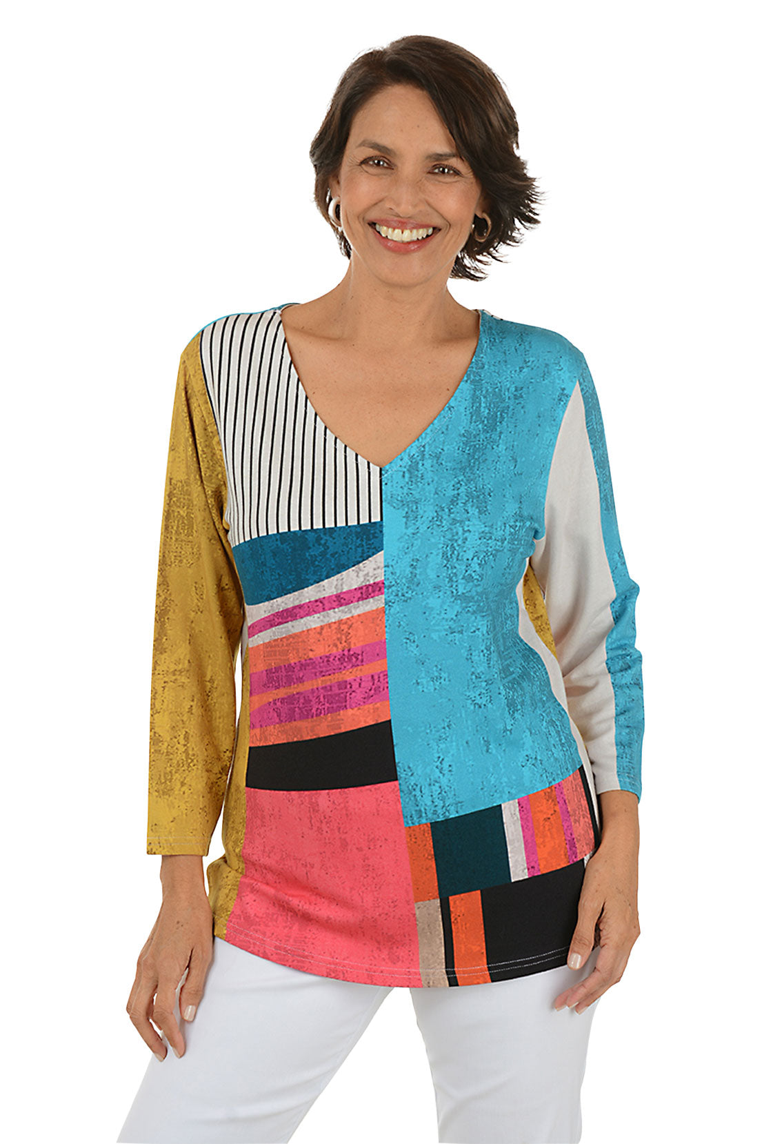 Woman wearing a colorful patterned top on a white background.