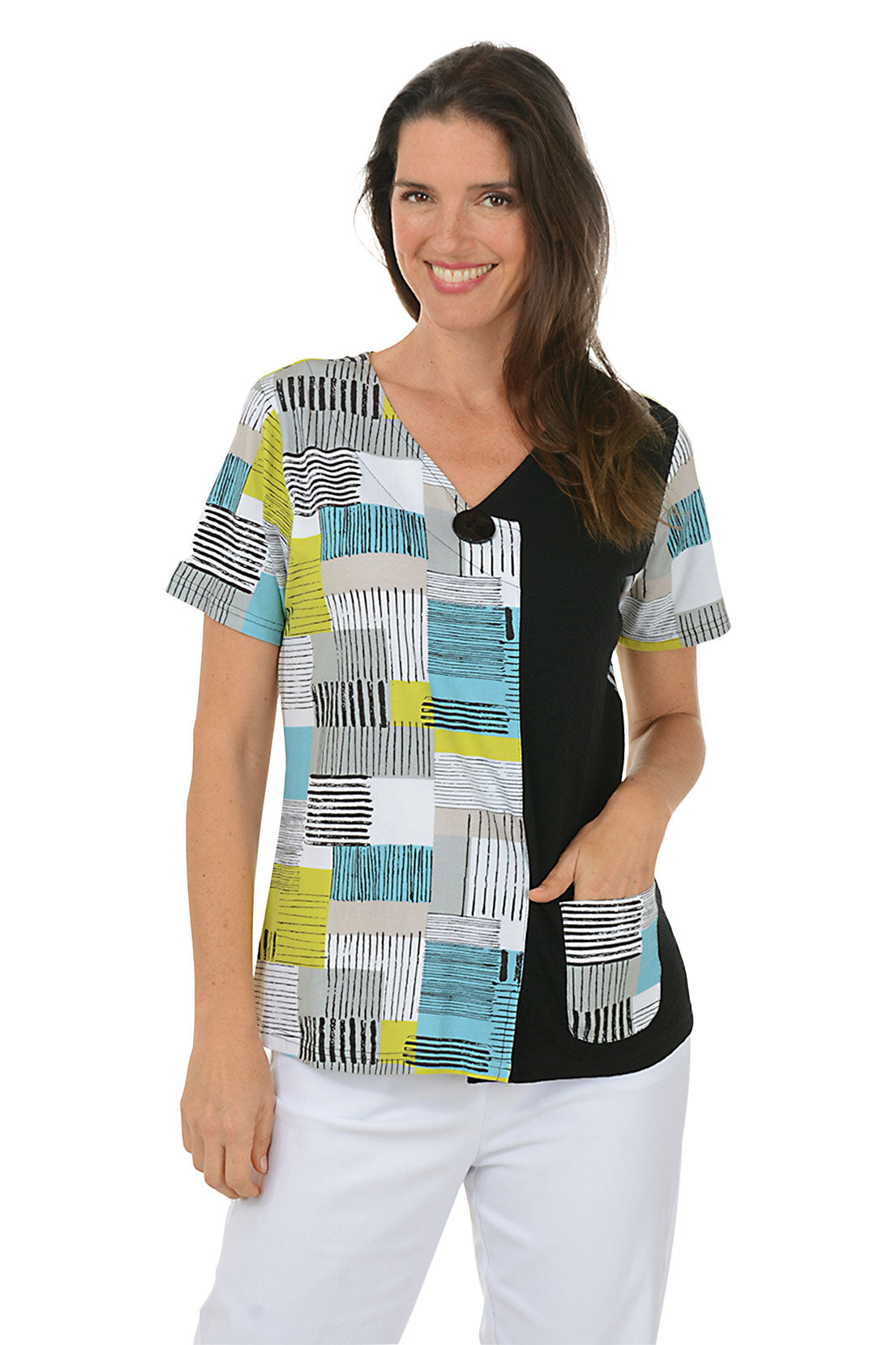 Woman wearing a patterned blouse with a white background.