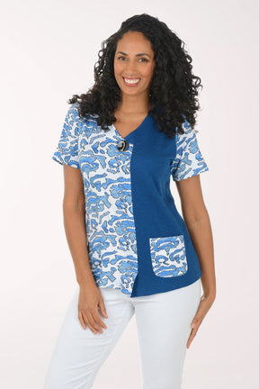 Woman wearing a blue and white patterned blouse top on a white background