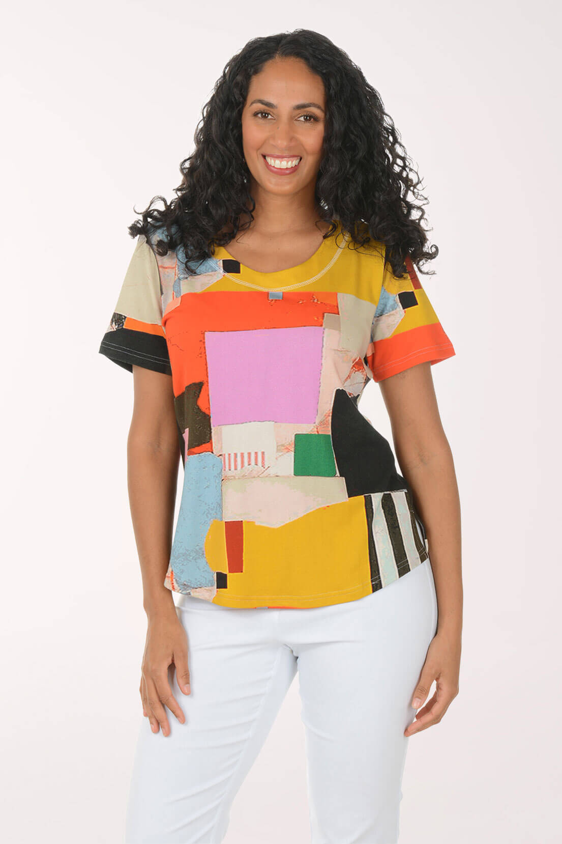 Woman wearing a colorful geometric-patterned shirt on a white background