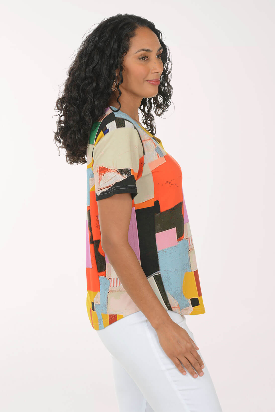 Side shot of our model in a multi pattern knit top.