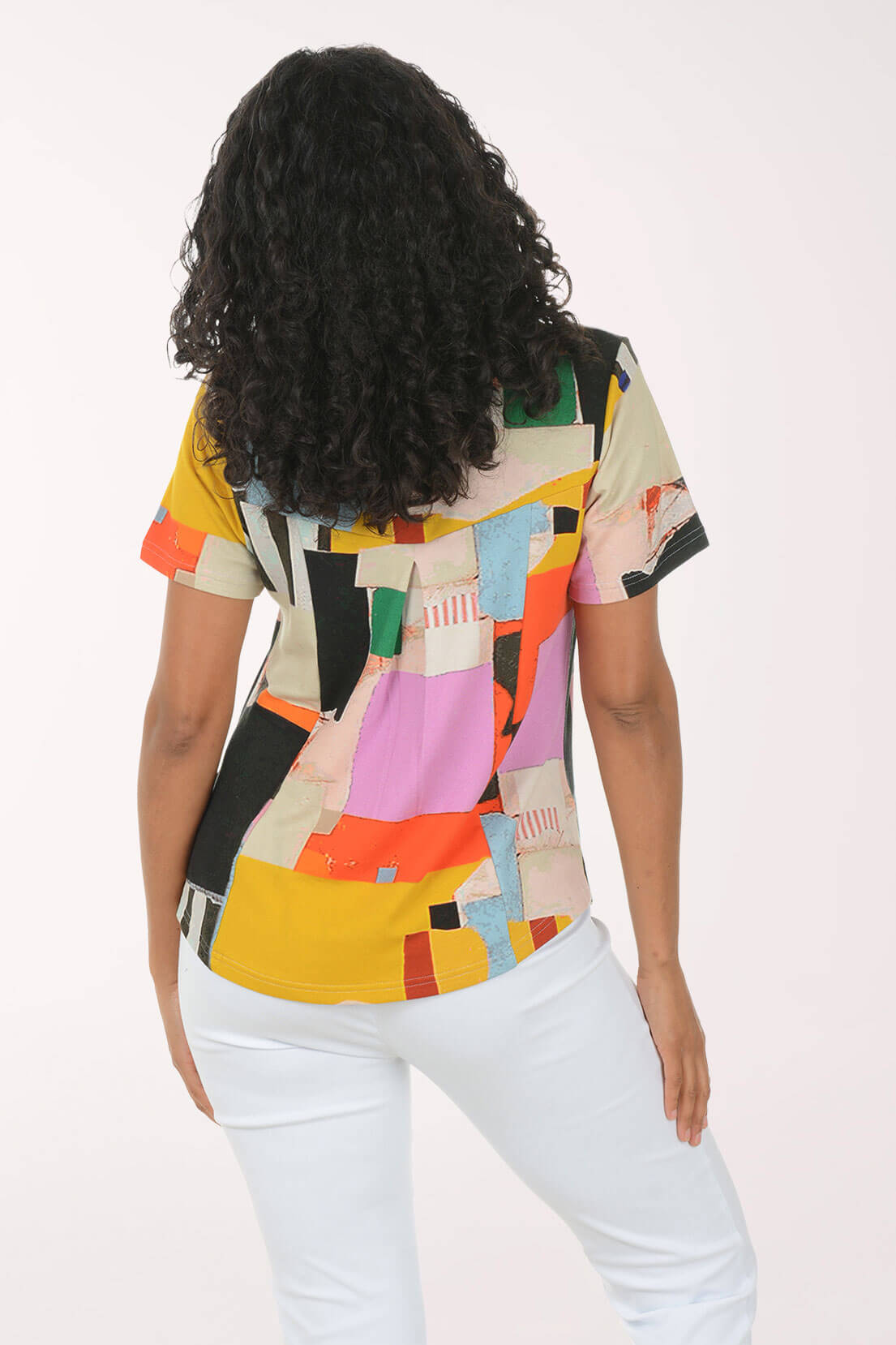 Back shot of our model in a multi pattern knit top.