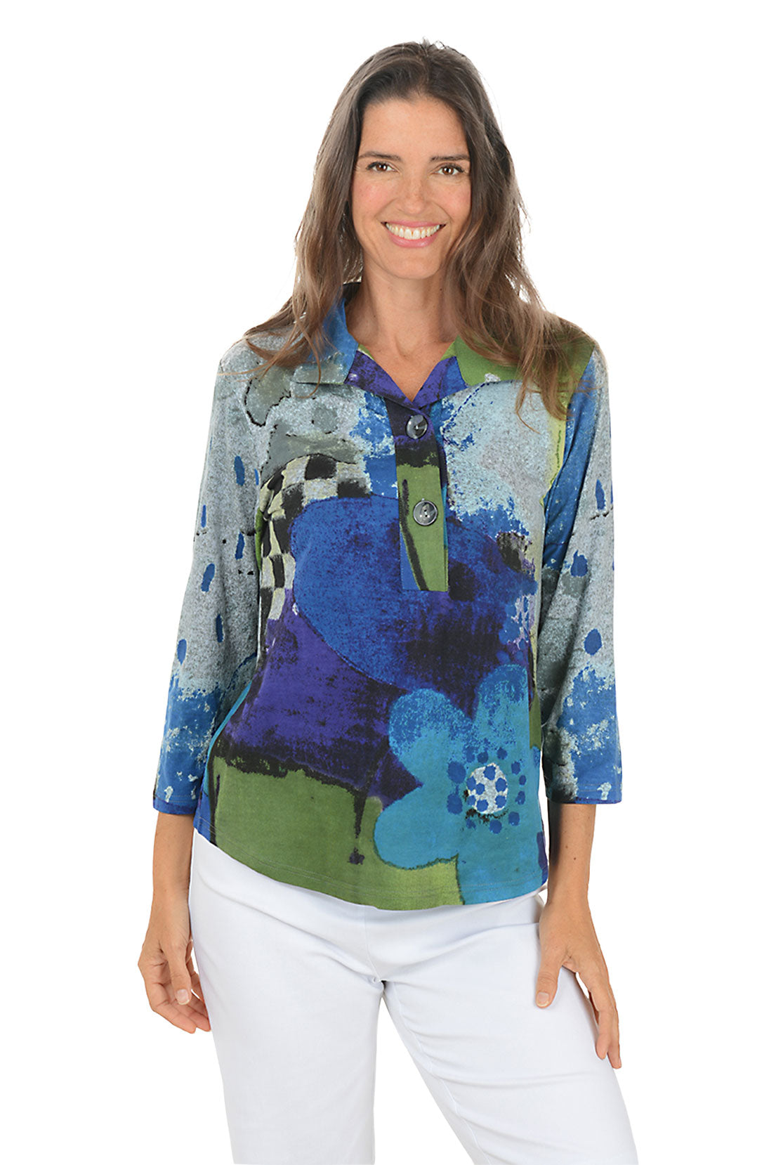 Woman wearing a blue multi colorful floral blouse with a white background.