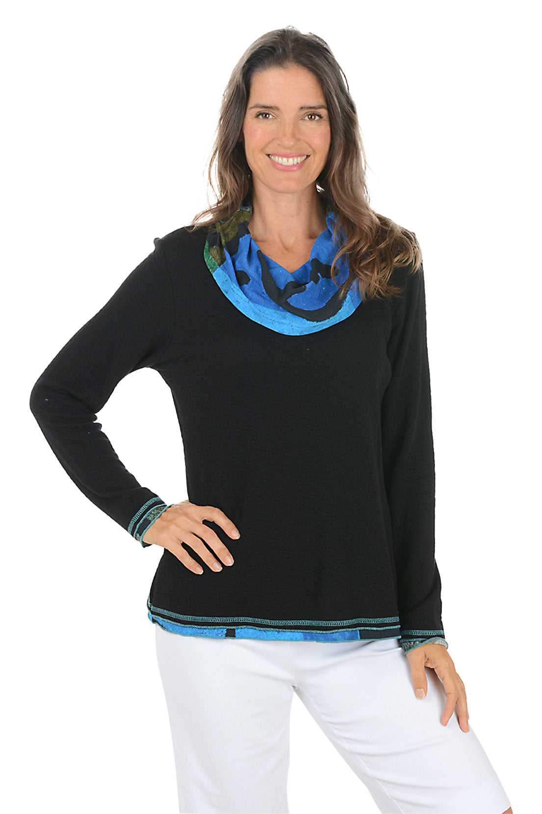 Woman wearing a black sweater with blue colorful trim on a white background.