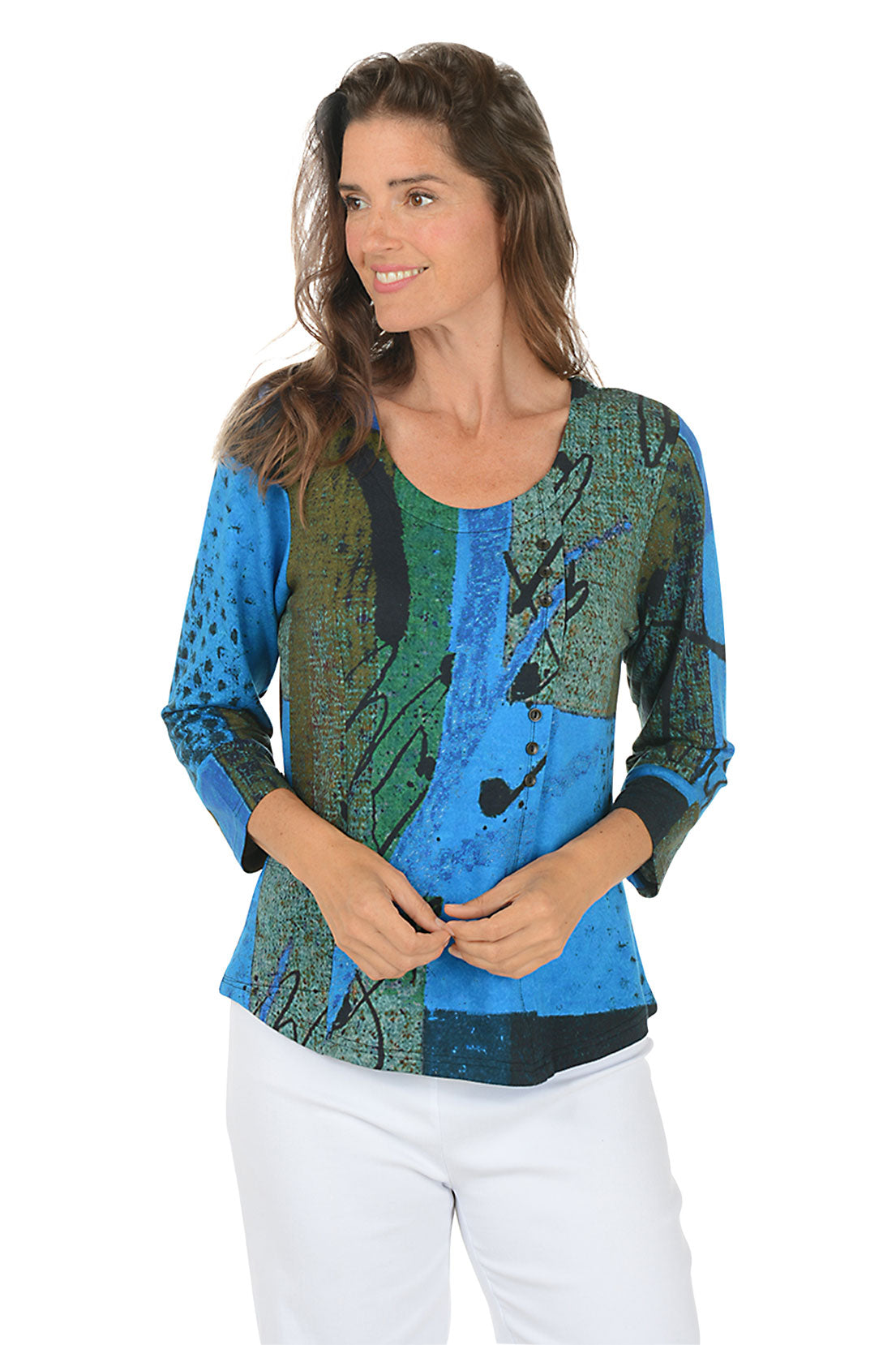 Woman wearing a colorful patterned top with blue and green design on a white background. Second front shot.