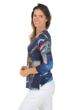 Woman wearing a 3/4 sleeve colorful abstract patterned top on a white background. Side shot.