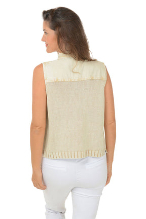 Back shot photo of our model wearing a cream color button-front denim sweater vest with a fold-over collar, dual front pockets, and a straight hemline. She is also wearing white pants.