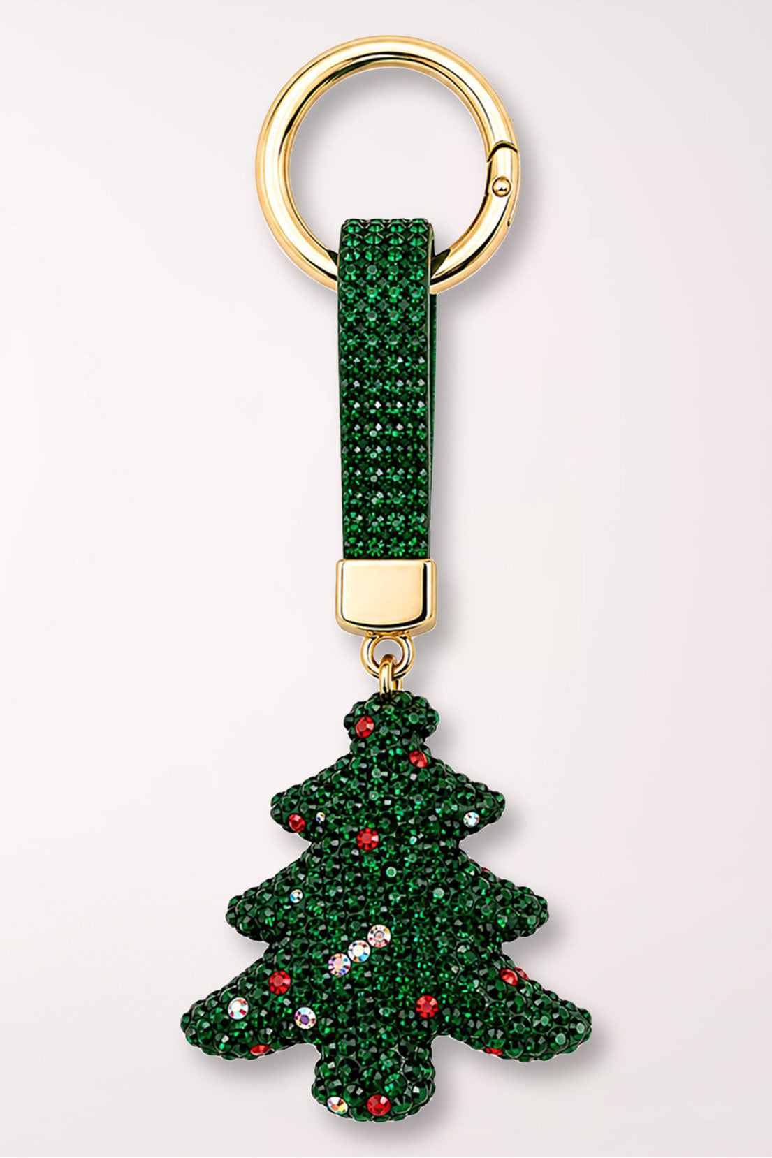 A green rhinestone Christmas tree bag charm with colorful rhinestone ornaments, on a green rhinestone strap with a gold ring.