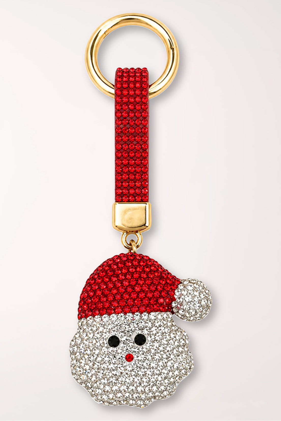A rhinestone Santa Claus face bag charm with a red hat and white beard, on a red rhinestone strap with a gold ring.