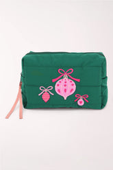 A green quilted cosmetics pouch with pink embroidered holiday ornaments and bows, and a pink zipper pull.