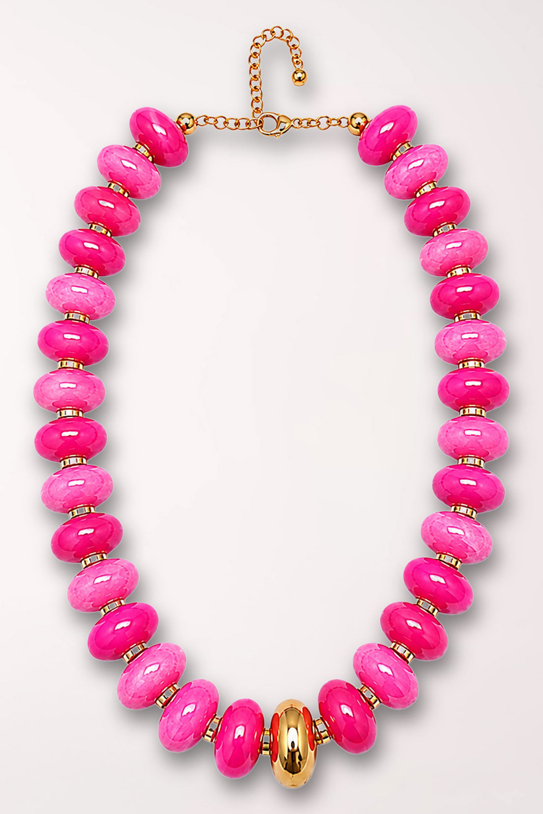 Gold Accent Marble Bead Necklace in Hot Pink, laid flat: a strand of large rounded marbled beads in hot pink and lighter pink, separated by small gold spacers, with a polished gold oval bead at center front and a gold lobster clasp with extender chain.