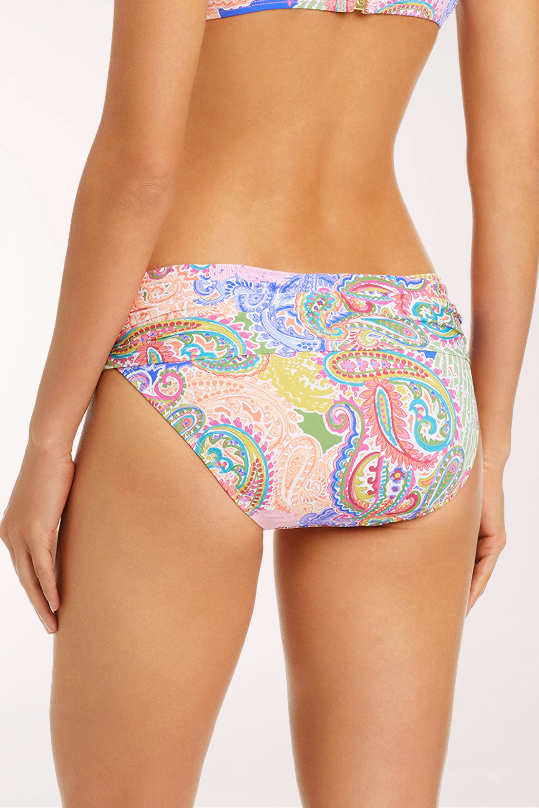 Close-up back view of the La Vida Bohemia Sarong Hipster Bikini Bottom in a paisley patchwork print in pink, lavender, lime green, coral and cobalt blue, showing the wide waistband and full rear coverage.