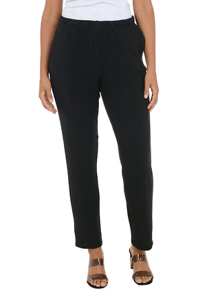 Black fleece lounge pants worn by a person on a white background.