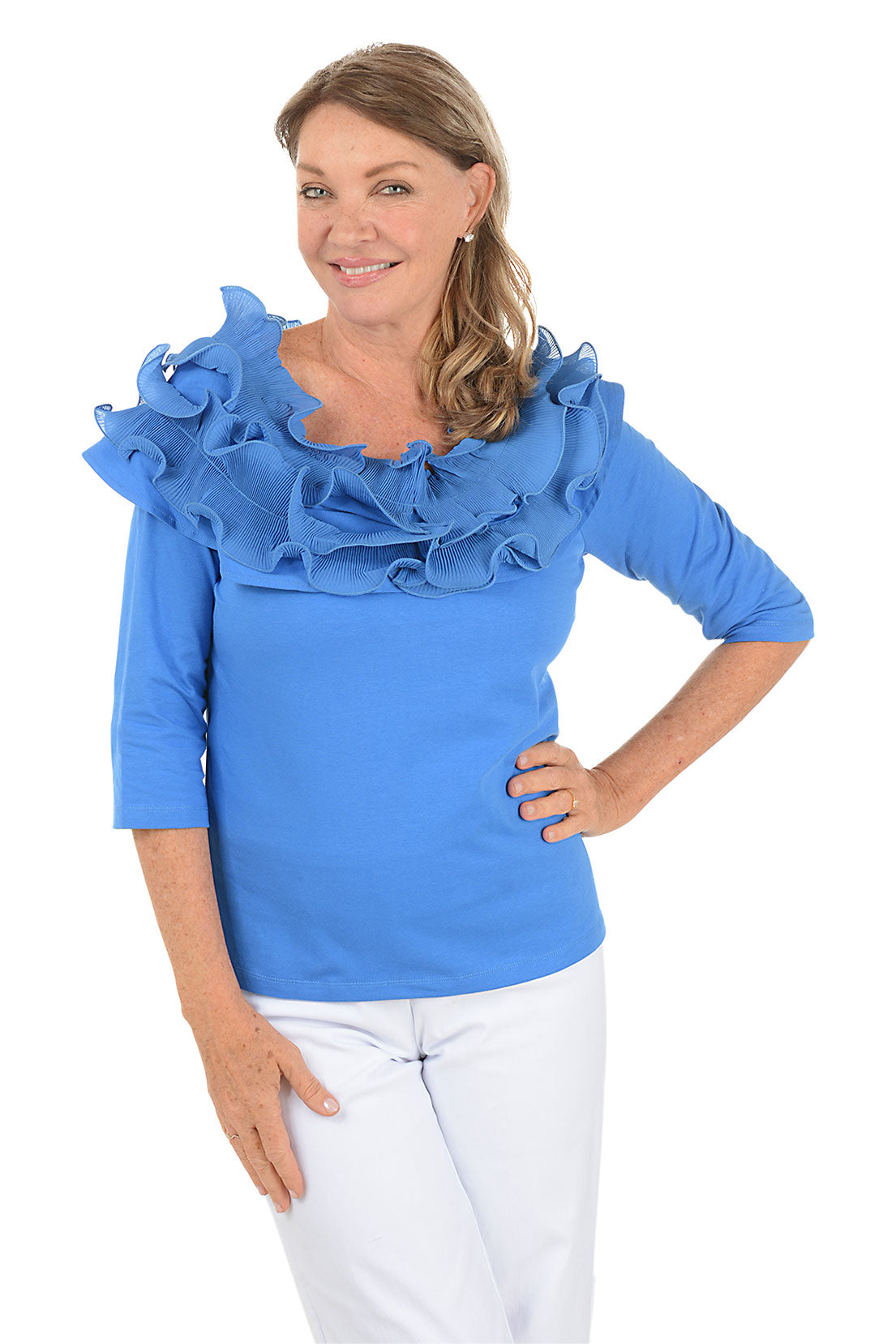 Woman wearing a blue off-shoulder top with ruffles on a white background.