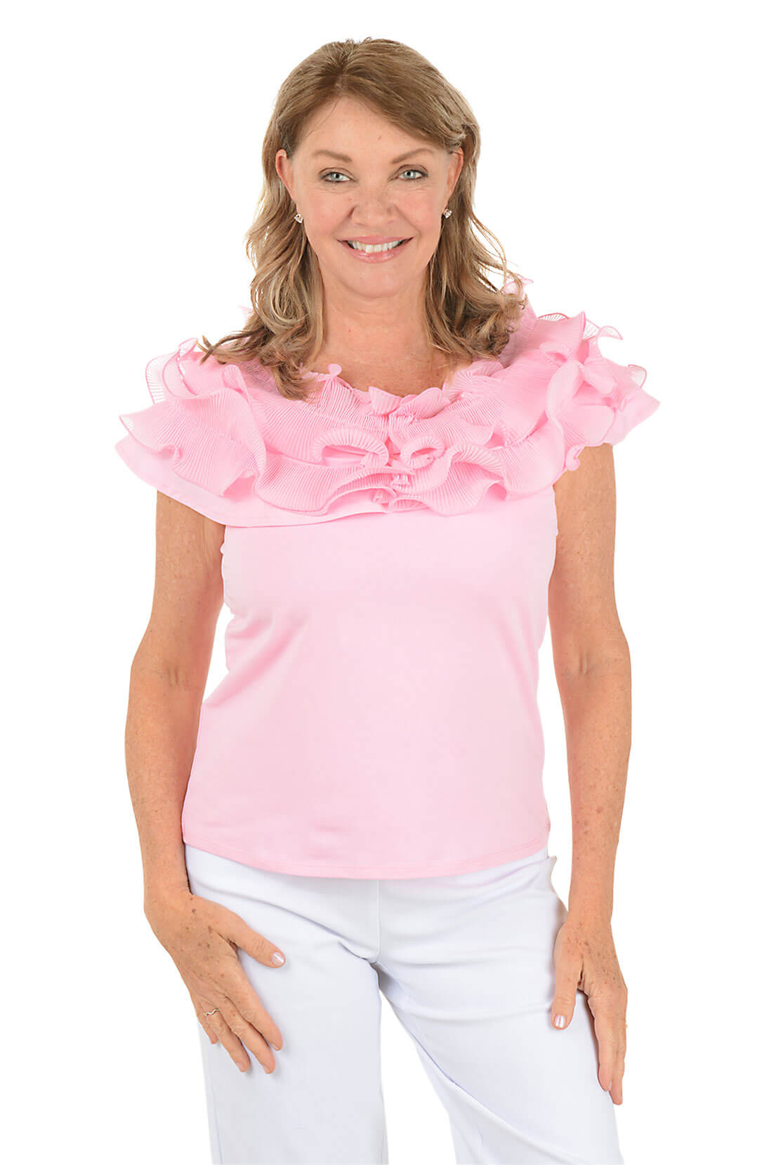 Woman wearing a pink blouse with ruffled sleeves on a white background