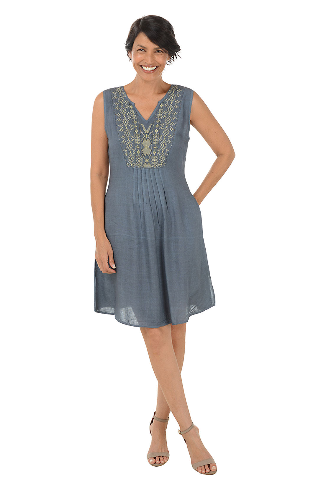 Woman wearing a sleeveless grey dress