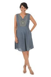 Woman wearing a sleeveless grey dress