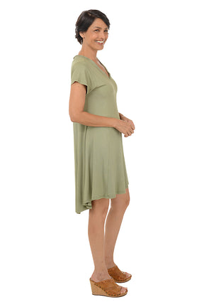 Woman wearing a solid short sleeve olive dress