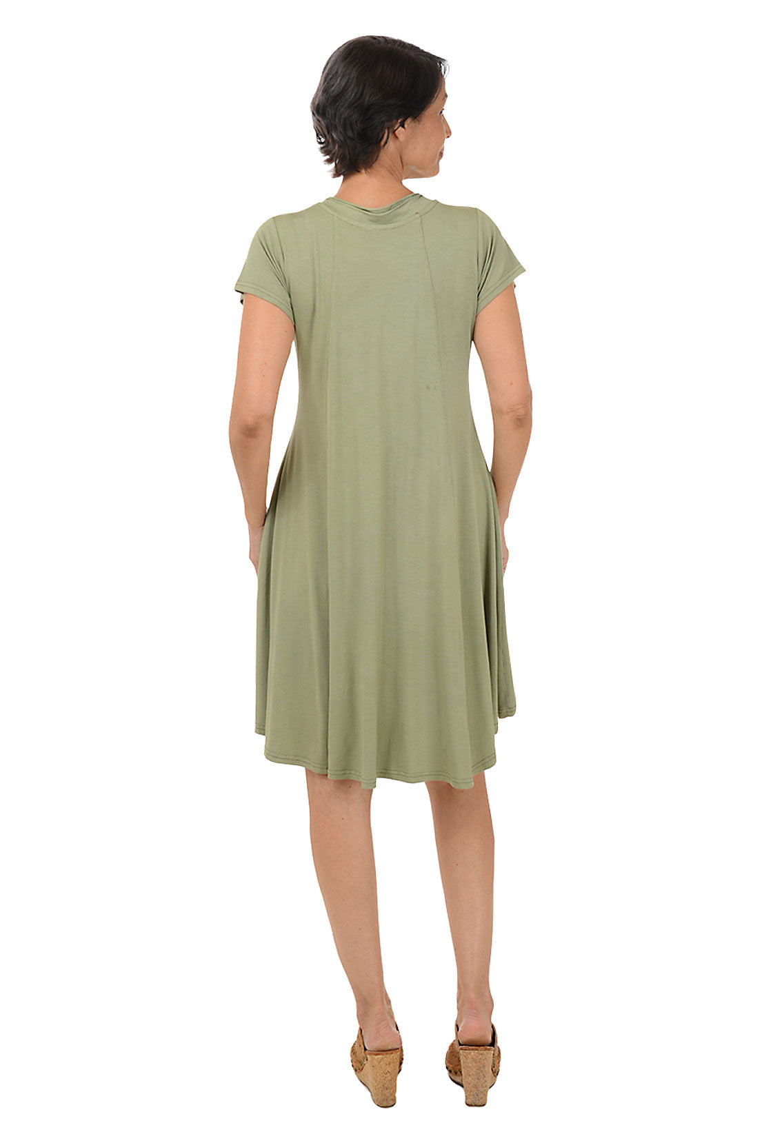 Woman wearing a solid short sleeve olive dress