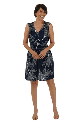 Woman wearing a sleeveless navy dress 