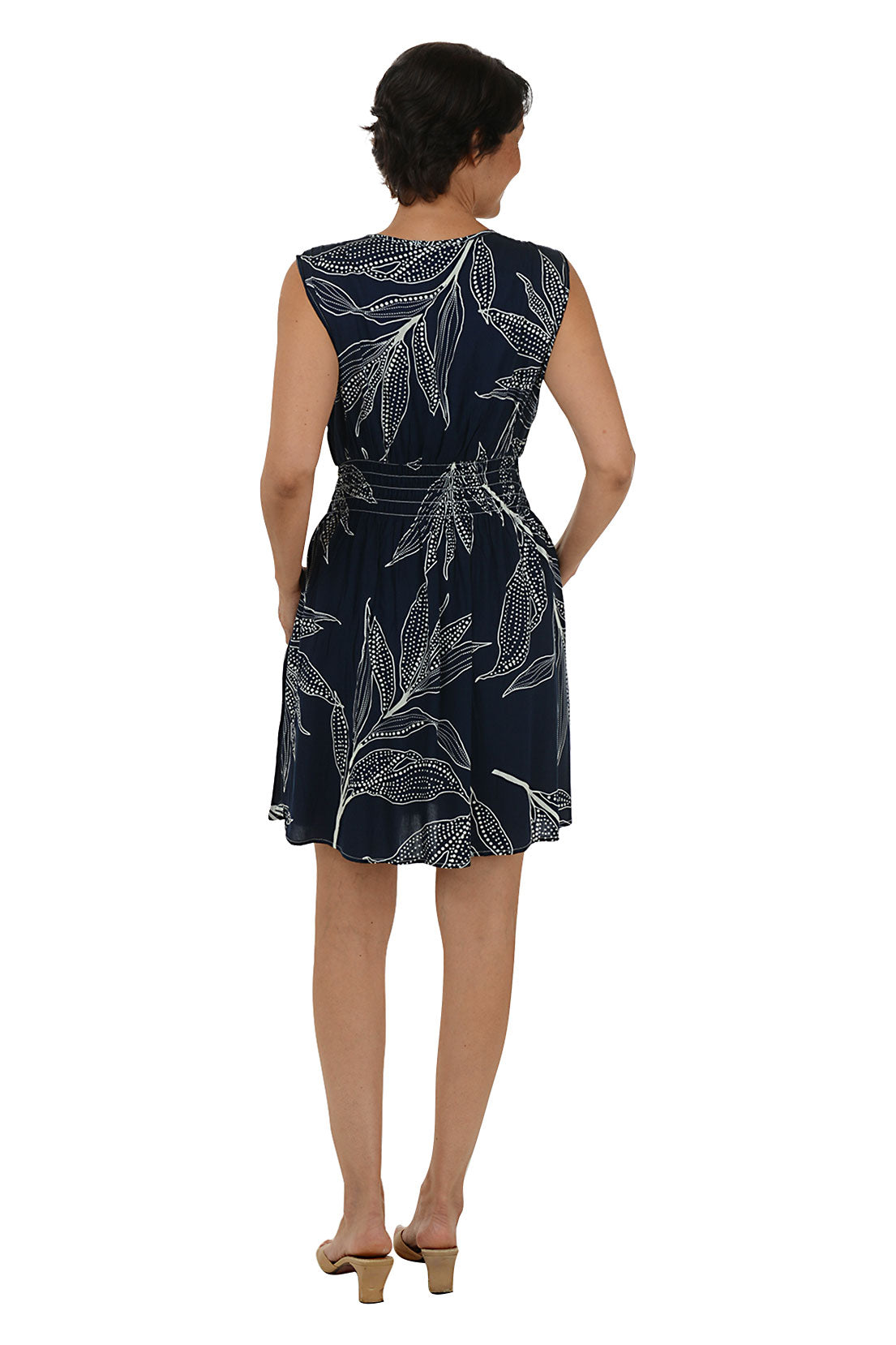 Woman wearing a sleeveless navy dress 