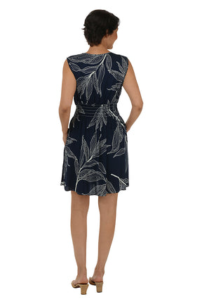 Woman wearing a sleeveless navy dress 