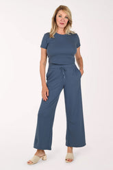 Woman wearing a two piece lounge set in blue