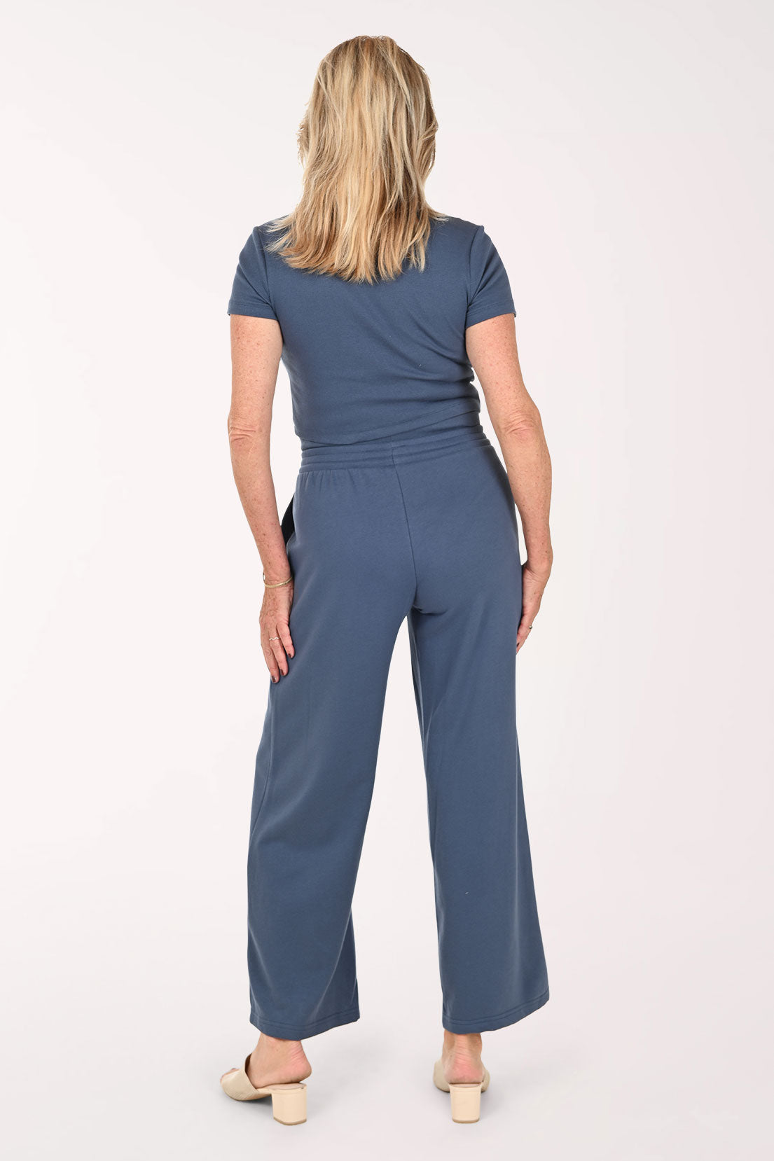 Woman wearing a two piece lounge set in blue