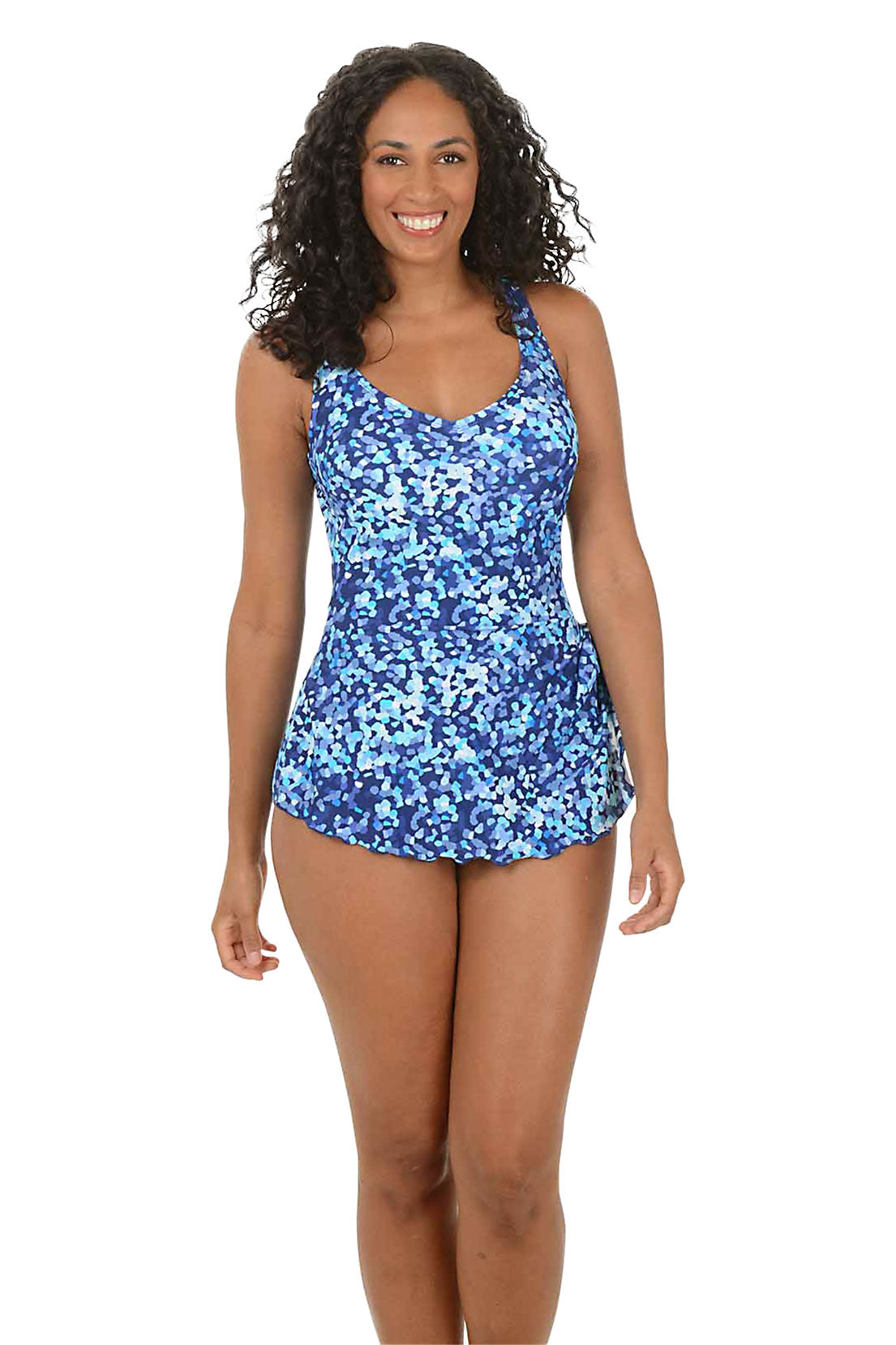 Woman wearing a blue floral swimsuit on a white background.