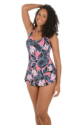 Woman wearing a floral swimsuit on a white background.