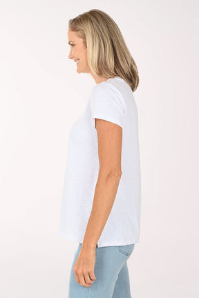 Woman wearing a short sleeve white top