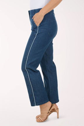 Person wearing blue jeans on a white background