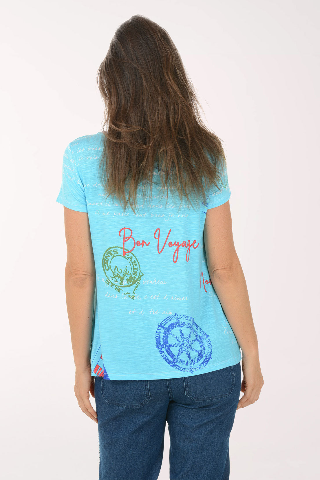 Woman wearing a light blue t-shirt with graphics and text on a white background